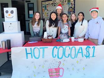 LSC members sell hot cocoa to benefit the library